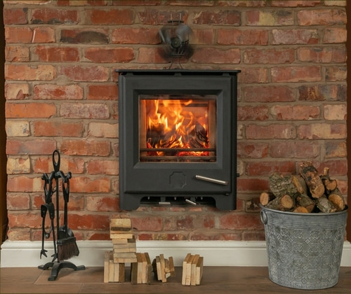 Wood-burning stove built into a brick wall