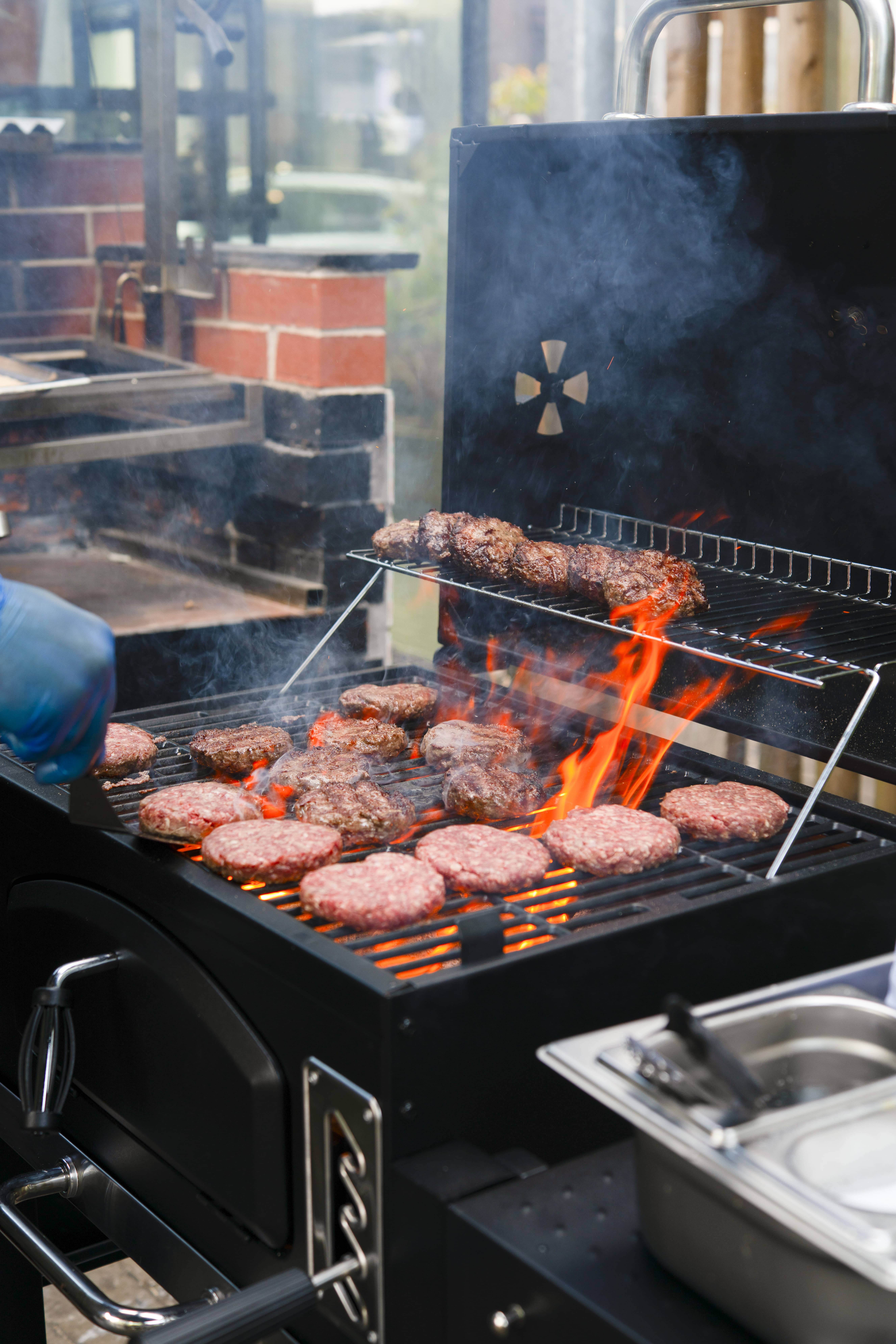 Burgers cooking on a VonHaus American BBQ