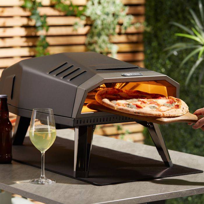 VonHaus black gas pizza oven in sunny garden