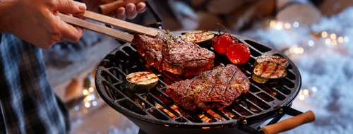 Man barbecuing in winter