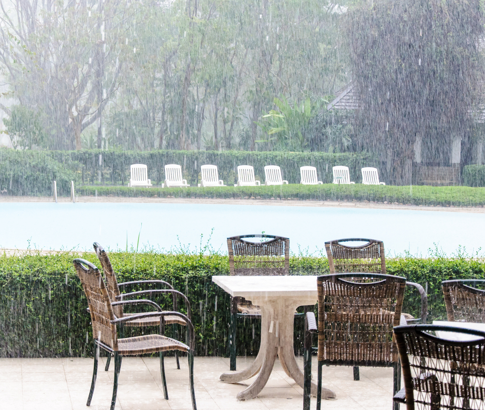 Rattan chairs outside in the rain
