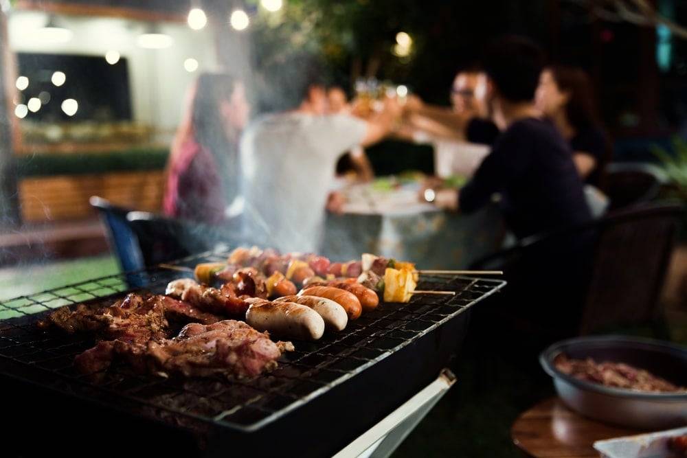 Sausages and vegetables on a BBQ