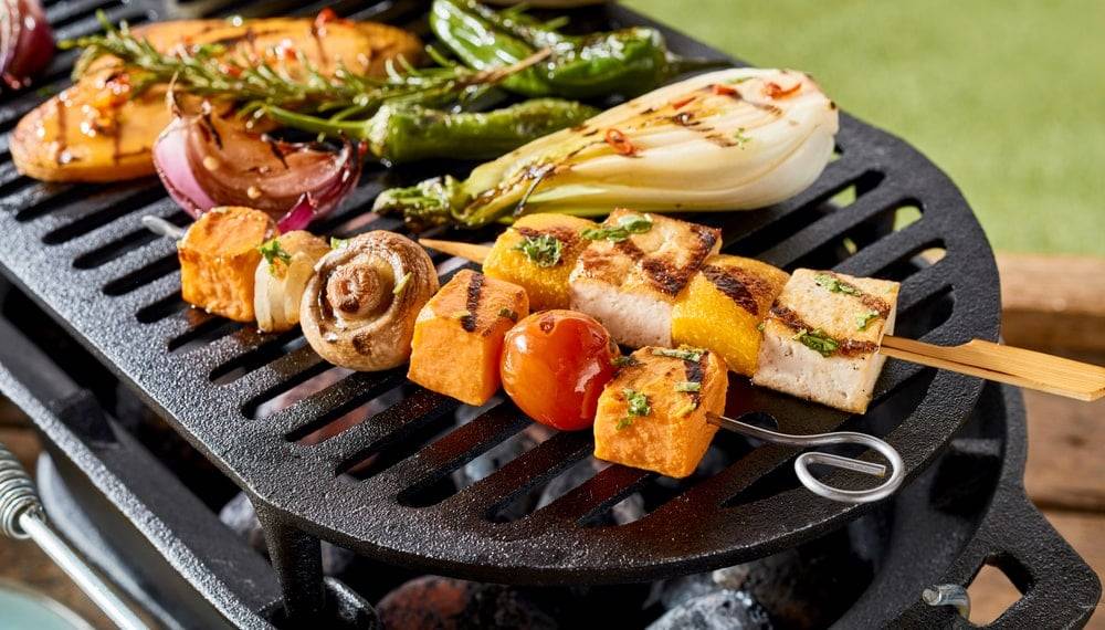 Tofu kebab skewers sizzling on a barbecue