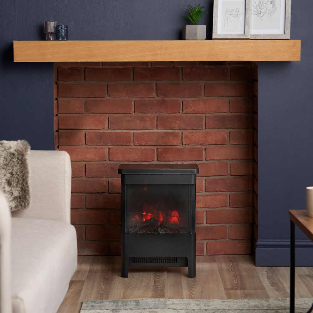 VonHaus electric stove heater in a living room fireplace