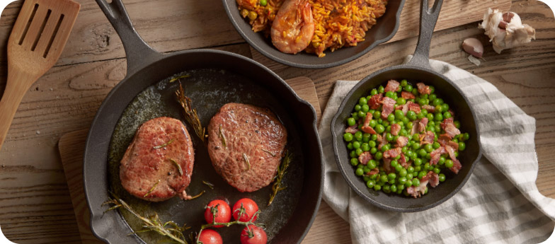 Vonshef Cast Iron Pans On Table With Food