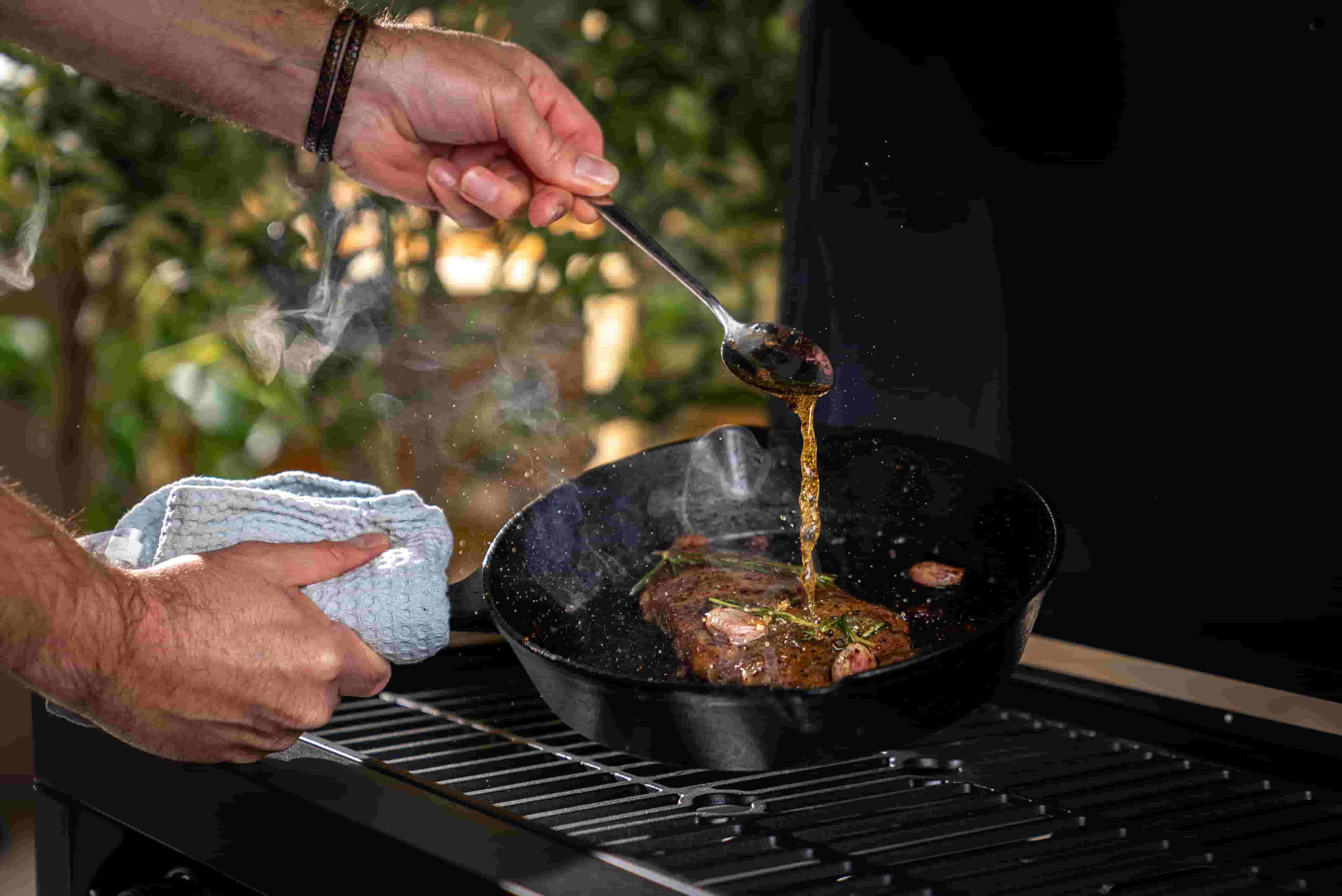 Man cooking with Vonshef cast iron pan