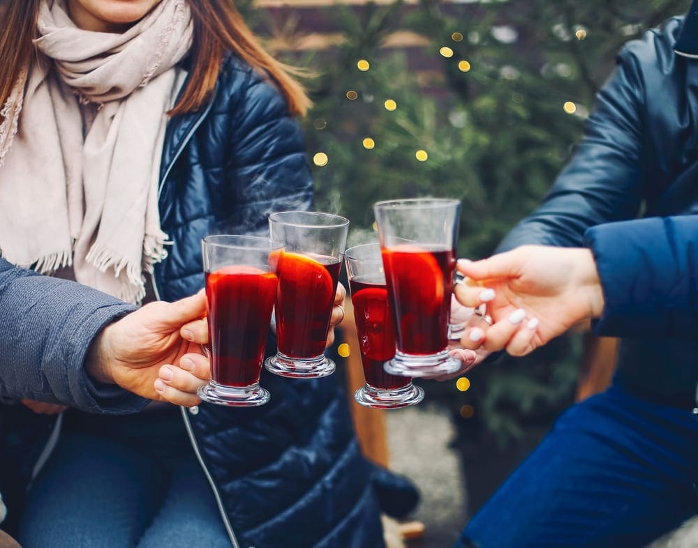 Young group toasting with mulled wine