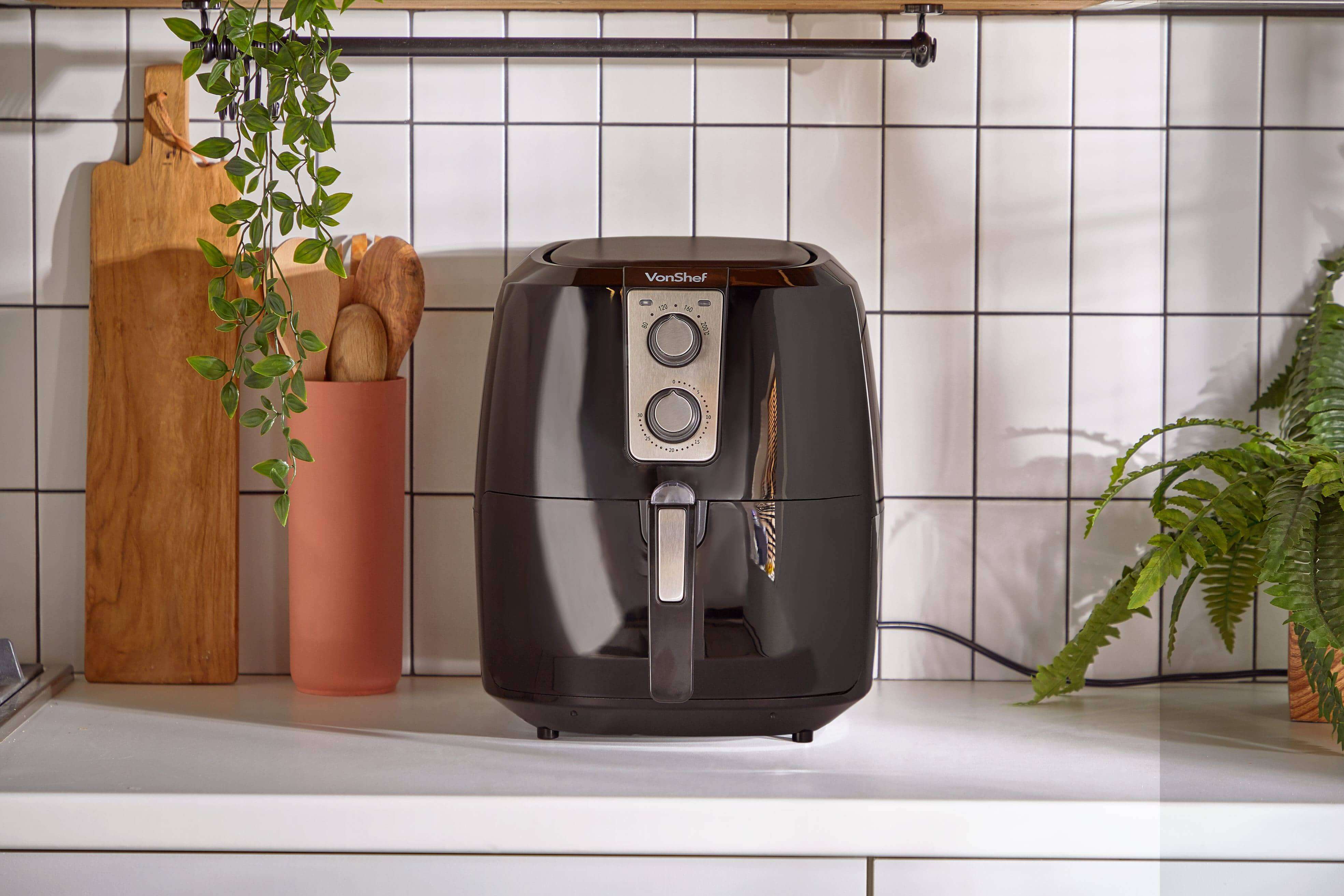 VonShef air fryer on a countertop against a white tiled backdrop 