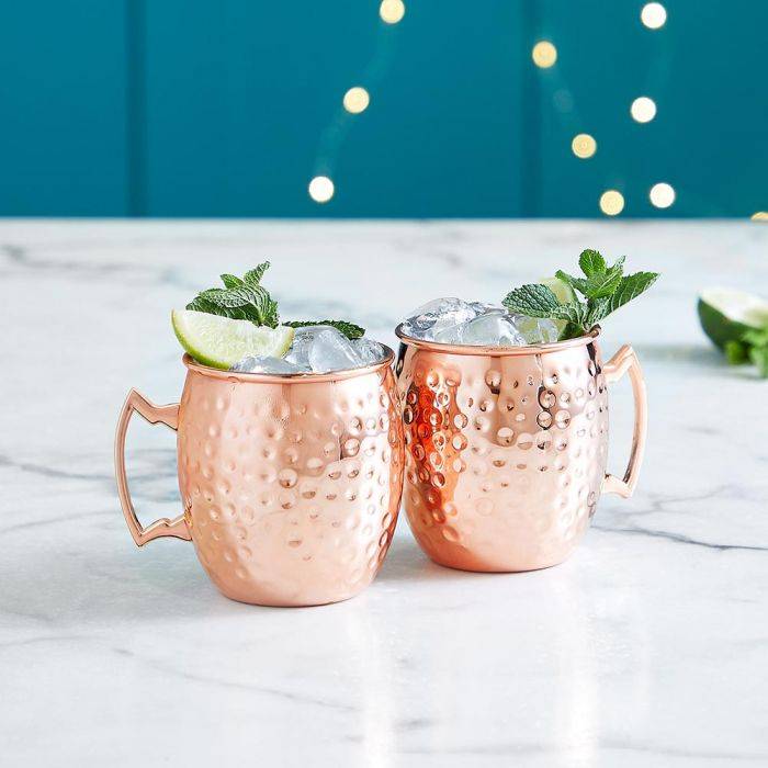 prosecco margarita cocktail in two brass coloured moscow mule mugs