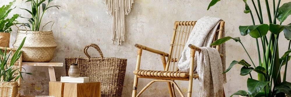 A rattan chair in a bohemian-style backyard